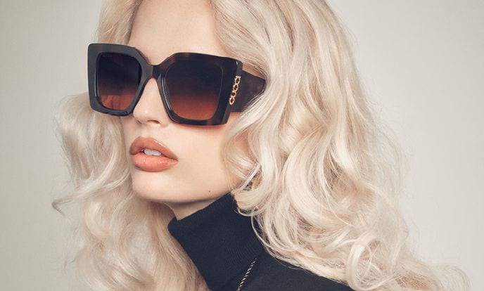 A woman in wide cat-eye Gucci sunglasses from the Spring Summer 2026 campaign