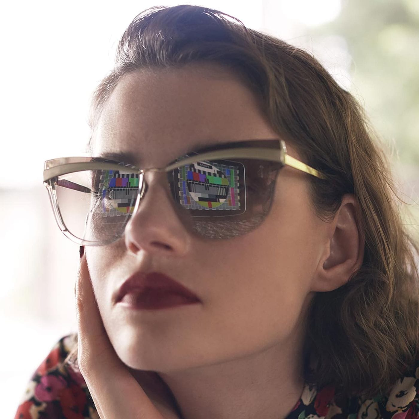 A woman wearing Prada Cinema Evolution sunglasses