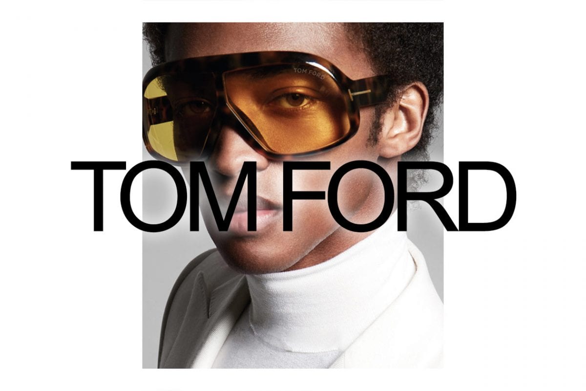 A Tom Ford eyewear campaign image of a model in oversized amber-lens sunglasses