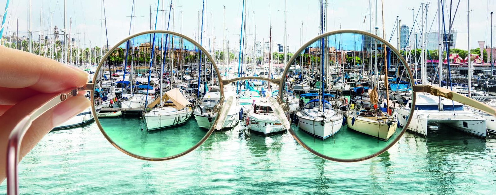 Looking at a marina through a pair of polarised lenses: the water is clear and free of glare inside the lenses