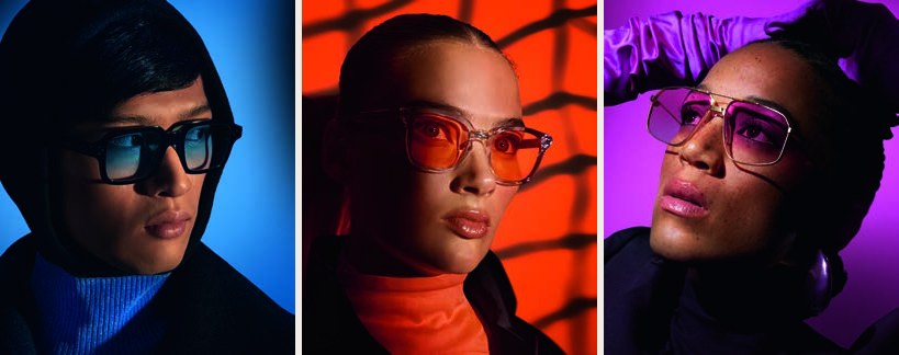 Three people wearing Sensity Colours glasses in orange, blue and purple