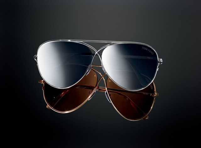 Two Tom Ford Private Collection aviators on a dark background